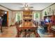 Dining room with a large table, fireplace and natural light at 3116 Old Montgomery Place Rd, Monroe, NC 28112