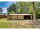 Exterior of detached two-car garage with double doors, metal roof, and convenient drive-up access at 3116 Old Montgomery Place Rd, Monroe, NC 28112