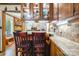 Bright kitchen featuring wood cabinets with glass doors and bar stool seating at the breakfast bar at 3116 Old Montgomery Place Rd, Monroe, NC 28112