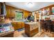 Eat-in kitchen with wood cabinets, black appliances and wood flooring, adjacent to breakfast bar at 3116 Old Montgomery Place Rd, Monroe, NC 28112