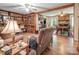 Cozy living room with built-in bookshelves, fireplace, and wood flooring at 3116 Old Montgomery Place Rd, Monroe, NC 28112