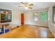 Bright living room with hardwood floors, neutral walls, and a ceiling fan at 3116 Old Montgomery Place Rd, Monroe, NC 28112