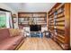 Inviting living room with wood-paneled bookshelves and comfortable seating at 3116 Old Montgomery Place Rd, Monroe, NC 28112