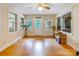 Bright living room features hardwood floors, large windows, and a welcoming atmosphere at 3116 Old Montgomery Place Rd, Monroe, NC 28112