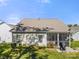 Cozy screened-in porch and patio area for outdoor entertaining on the level lawn of the backyard at 31226 Cove View Ct, Lancaster, SC 29720