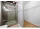 Modern bathroom featuring a glass enclosed shower and built in shelving at 31226 Cove View Ct, Lancaster, SC 29720