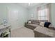 Small guest bedroom featuring a pull-out couch and neutral paint at 31226 Cove View Ct, Lancaster, SC 29720