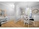 Elegant dining area with wainscoting, stylish lighting, and a cozy atmosphere at 31226 Cove View Ct, Lancaster, SC 29720