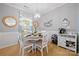 Bright dining area with hardwood floors, a round table, and nautical-themed decor at 31226 Cove View Ct, Lancaster, SC 29720