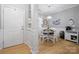 Cozy dining nook featuring natural light, nautical decor, and hardwood floors at 31226 Cove View Ct, Lancaster, SC 29720