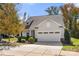Well-maintained home featuring a three-car garage and manicured landscaping at 31226 Cove View Ct, Lancaster, SC 29720