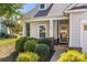 Charming home entrance with a covered porch, well-maintained landscaping, and stylish exterior details at 31226 Cove View Ct, Lancaster, SC 29720
