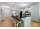 Open kitchen features granite countertops, stainless steel appliances, and a large island with seating at 31226 Cove View Ct, Lancaster, SC 29720