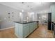Spacious kitchen island with granite countertops, stainless steel sink, and cabinets at 31226 Cove View Ct, Lancaster, SC 29720