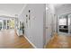 Stylish living room with hardwood floors, access to a balcony, and lake views at 31226 Cove View Ct, Lancaster, SC 29720