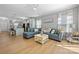 Bright and airy living room with an open layout, connecting the kitchen and living spaces at 31226 Cove View Ct, Lancaster, SC 29720
