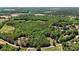 A vast aerial view shows rolling hills and dense forest in the distance at 370 Shiloh Rd, Statesville, NC 28677