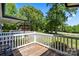 Wooden back deck overlooks the lush backyard and features white railings and a seating area at 370 Shiloh Rd, Statesville, NC 28677