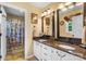 A modern bathroom offers double sinks, granite countertops, and ample counter space at 370 Shiloh Rd, Statesville, NC 28677