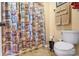 Standard bathroom featuring toilet, decorative shower curtain, and beige wall color at 370 Shiloh Rd, Statesville, NC 28677
