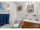 Standard bathroom featuring a single sink vanity and toilet at 370 Shiloh Rd, Statesville, NC 28677