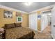 Bedroom featuring neutral walls, carpet, and a double bed with closet and a window at 370 Shiloh Rd, Statesville, NC 28677