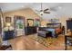 A sunny bedroom features hardwood floors and a ceiling fan at 370 Shiloh Rd, Statesville, NC 28677