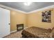 Cozy bedroom with tan walls, patterned wallpaper trim, and a small bed at 370 Shiloh Rd, Statesville, NC 28677