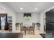Eat in kitchen with tile floors, a table with chairs and a refrigerator against the wall at 370 Shiloh Rd, Statesville, NC 28677