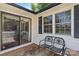 Exterior patio with sliding glass doors, bench, and windows offers an inviting outdoor space at 370 Shiloh Rd, Statesville, NC 28677