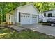 Two-car garage with double doors, stone foundation, concrete driveway and camper parking at 370 Shiloh Rd, Statesville, NC 28677