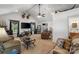 Expansive living room with vaulted ceilings, carpet, a ceiling fan and a view into the kitchen at 370 Shiloh Rd, Statesville, NC 28677
