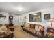 Comfortable living room with carpet, sofa, light walls, a mirror, side table and a view to the kitchen at 370 Shiloh Rd, Statesville, NC 28677
