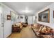 Cozy living room with carpet, two sofas, an ornate mirror and a view into another room at 370 Shiloh Rd, Statesville, NC 28677