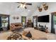 Well-lit living room with vaulted ceilings, carpet, a ceiling fan and many nautical decor items at 370 Shiloh Rd, Statesville, NC 28677