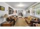 Spacious living room with carpet, sofas, light walls, a large window, and a view into another room at 370 Shiloh Rd, Statesville, NC 28677