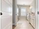 Bright bathroom featuring a glass shower, modern vanity, and neutral tile flooring at 371 Luray Way, Rock Hill, SC 29730