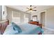 Relaxing bedroom with a wood bed frame, natural light, and a ceiling fan at 371 Luray Way, Rock Hill, SC 29730