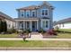 Charming two-story home featuring a welcoming front porch with a swing and a well-manicured landscaped yard at 371 Luray Way, Rock Hill, SC 29730
