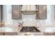Close-up of a modern kitchen featuring stainless steel appliances and a gas range at 371 Luray Way, Rock Hill, SC 29730