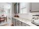 Bright kitchen featuring gray cabinets, marble counters, subway tile backsplash and stainless steel appliances at 371 Luray Way, Rock Hill, SC 29730