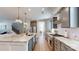 Modern kitchen with a large island, granite countertops, stainless steel appliances, and stylish pendant lighting at 371 Luray Way, Rock Hill, SC 29730