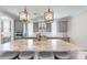 Spacious kitchen island with marble countertop, sink, pendant lighting, and seating for four at 371 Luray Way, Rock Hill, SC 29730
