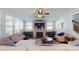 Bright living room with a brick fireplace, entertainment units and views into other areas of the home at 371 Luray Way, Rock Hill, SC 29730