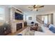 Comfortable living room featuring a brick fireplace, large television, and cozy seating at 371 Luray Way, Rock Hill, SC 29730