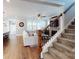 Open-concept living room and kitchen with hardwood floors, white sofa, and fireplace at 371 Luray Way, Rock Hill, SC 29730
