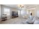 Cozy living room featuring plush seating, a large TV, and abundant natural light at 371 Luray Way, Rock Hill, SC 29730