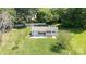 Aerial view of the outbuilding nestled in a lush green lawn at 374 Queens Sw Dr, Concord, NC 28025