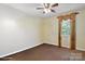 A bright bedroom is shown with brown carpet, yellow walls, and a window with decorative curtain at 374 Queens Sw Dr, Concord, NC 28025