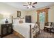 Bedroom showcasing a metal bed, side tables, complementary decor and a comfortable retreat at 374 Queens Sw Dr, Concord, NC 28025
